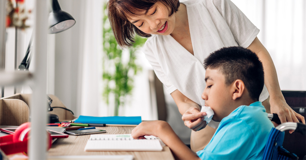 Parent supporting child during OPWDD Program for Children with Disabilities in-home care session