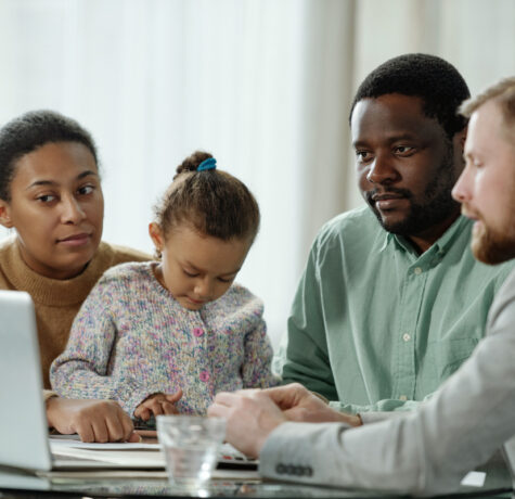Family with child meeting with a support broker to review the OPWDD Self-Direction Program plan and budget