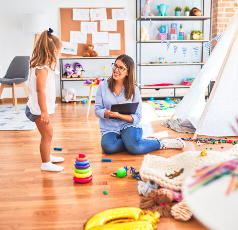 Trained caregiver engaging warmly with a child during an in-home respite care for special needs session