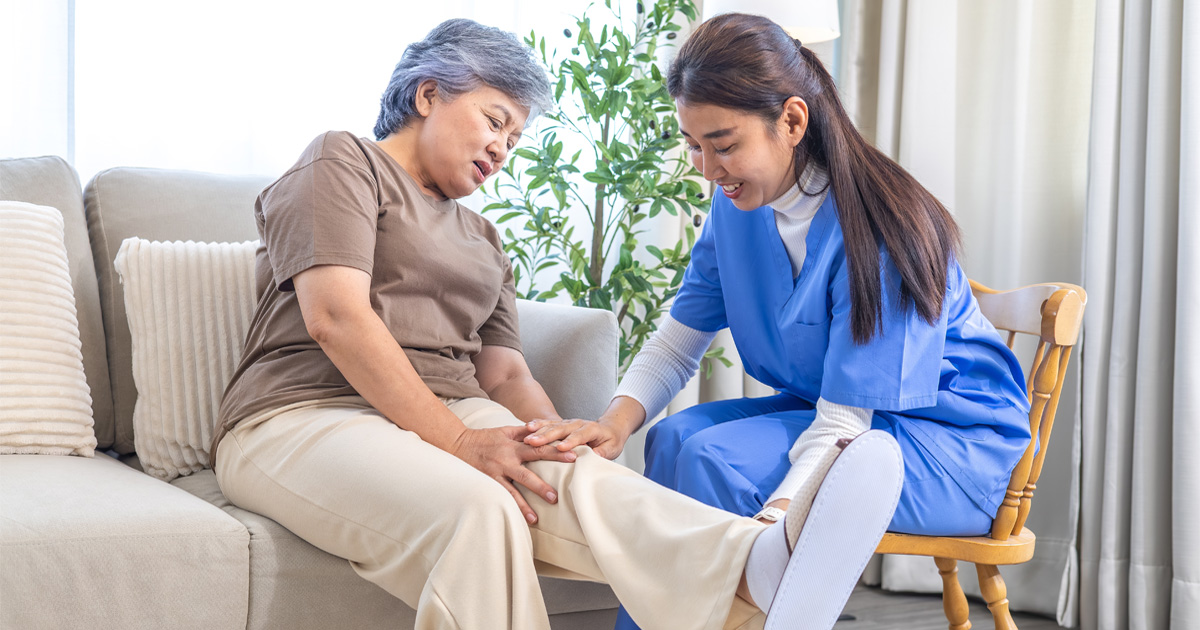 Caregiver and home health aide in Brooklyn NY helping senior at home