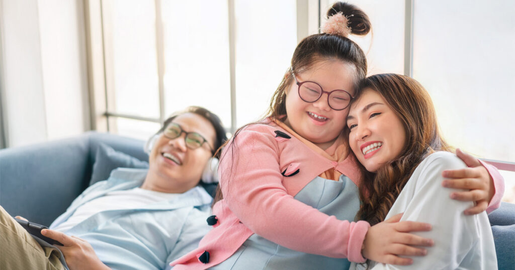 Parents raising a child with disabilities while managing daily family routines at home