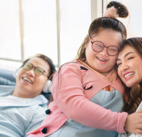 Parents raising a child with disabilities while managing daily family routines at home