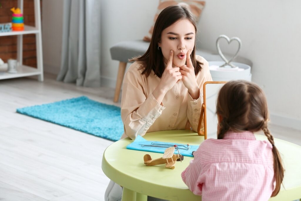 Caregiver working with a child through the OPWDD program in Yonkers NY during a structured in-home skill-building session