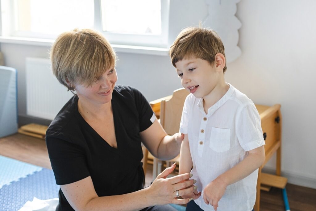 Caregiver providing special needs care in Westchester NY with a child during a structured in-home support session